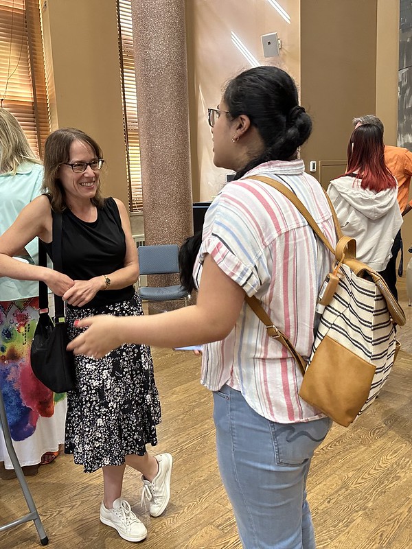 A student talking to a professor