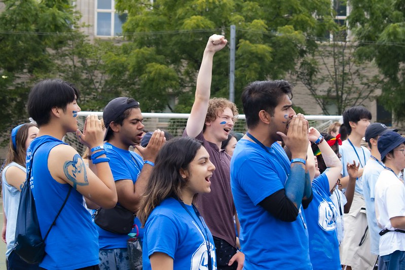 Students cheering at an orientation event